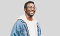 Portrait happy smiling african man looking away wearing an eyeglasses on a gray background Royalty Free Stock Photo