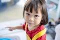 Portrait of happy smiling Asian child girl, She is playing happily Royalty Free Stock Photo