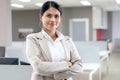 Portrait of happy smiling Asian woman officer worker standing with arms crossed, confident attractive female beautiful Royalty Free Stock Photo