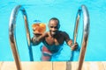 The portrait of happy smiling beautiful man at the pool