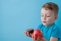 Portrait happy, smiling boy choosing junk food. Healthy versus unhealthy food. Healthy vs unhealthy eating, teenager choosing Royalty Free Stock Photo