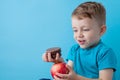 Portrait happy, smiling boy choosing junk food. Healthy versus unhealthy food. Healthy vs unhealthy eating, teenager choosing Royalty Free Stock Photo