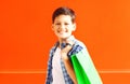 Portrait happy smiling boy teenager with shopping bag in city Royalty Free Stock Photo