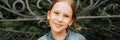 Portrait happy smiling candid eight year old kid girl face sits on bench in nature. prepubertal age of children and lives, mind ps Royalty Free Stock Photo