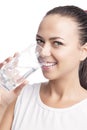 Portrait of Happy Smiling Caucasian Brunette Woman Drinking Clear Water from Glass Royalty Free Stock Photo