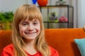 Portrait of happy smiling Caucasian preteen school girl child kid looking at camera, home play room Royalty Free Stock Photo