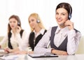 Portrait of happy smiling cheerful support phone operator in headset Royalty Free Stock Photo