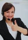 Portrait of happy smiling cheerful support phone operator in headset at office. Royalty Free Stock Photo