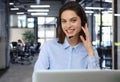 Portrait of happy smiling cheerful support phone operator in headset at office. Royalty Free Stock Photo