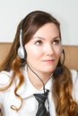 Portrait of happy smiling cheerful support phone operator in headset at office. Royalty Free Stock Photo