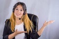 Portrait of happy smiling cheerful young support phone operator in headset showing copy space area or something Royalty Free Stock Photo