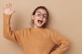 Portrait of happy smiling child girl with glasses emotions gesture hands Lifestyle unaltered Royalty Free Stock Photo