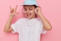 Portrait of happy smiling child girl listening to music on headphones isolated background Royalty Free Stock Photo