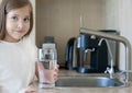 Portrait of happy smiling child with glass of fresh water. Consumption of tap water contributes to the saving of water in plastic Royalty Free Stock Photo