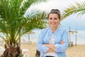 Portrait of happy smiling confident middle aged woman on beach Royalty Free Stock Photo