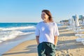 Portrait of happy smiling confident middle aged woman on beach Royalty Free Stock Photo