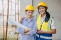 Portrait happy smiling construction Engineer women working team together builder architect designer work at construction site