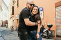 Portrait of happy smiling Couple at Bologna . tourist in Italy Happy Bearded man kissing and hugging on the streets of Italy Royalty Free Stock Photo