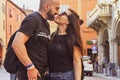 Portrait of happy smiling Couple at Bologna . tourist in Italy Happy Bearded man kissing and hugging on the streets of Italy Royalty Free Stock Photo