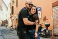 Portrait of happy smiling Couple at Bologna . tourist in Italy Happy Bearded man kissing and hugging on the streets of Italy Royalty Free Stock Photo