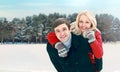 Portrait happy smiling couple having fun at winter day, man giving piggyback ride to woman Royalty Free Stock Photo