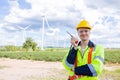 Portrait happy smiling engineer professional techician male working in wind turbines service location site Royalty Free Stock Photo
