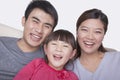 Portrait of happy and smiling family in casual clothing, studio shot, tilt