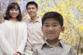 Portrait of happy smiling family in the park in springtime, Beijing, China Royalty Free Stock Photo