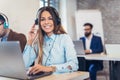 Portrait of happy smiling female customer support phone operator Royalty Free Stock Photo