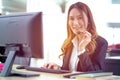 Portrait of happy smiling female customer support phone operator at workplace. Professional operator concept Royalty Free Stock Photo