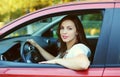 Happy smiling female driver sitting behind the wheel of car Royalty Free Stock Photo