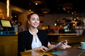 Portrait of a happy smiling gorgeous woman owner successful restaurant holding touch pad Royalty Free Stock Photo