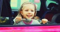 Portrait of happy smiling little child passenger sitting in the car Royalty Free Stock Photo