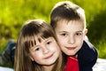 Portrait of happy smiling little children boy and girl on sunny Royalty Free Stock Photo