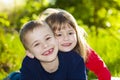 Portrait of happy smiling little children boy and girl on sunny Royalty Free Stock Photo