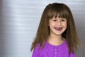 Portrait of happy smiling little girl with beautiful thick hair Royalty Free Stock Photo