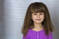 Portrait of happy smiling little girl with beautiful thick hair Royalty Free Stock Photo