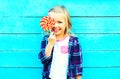 portrait happy smiling little girl child with a lollipop stick Royalty Free Stock Photo