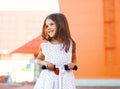 Portrait of happy smiling little girl on the scooter having fun Royalty Free Stock Photo