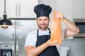 Portrait of happy smiling man preparing fresh natural meal salmon at kitchen. Handsome cheerful chef man preparing raw Royalty Free Stock Photo