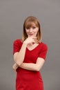 Portrait of a happy smiling mature woman with hand on chin looking at camera. Close up face of beautiful woman with fair Royalty Free Stock Photo