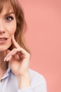 Portrait of a happy smiling mature woman with hand on chin looking at camera. Close up face of beautiful woman with fair Royalty Free Stock Photo