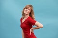 Portrait of a happy smiling mature woman with hands on her waist, looking at camera. Close up face of beautiful woman Royalty Free Stock Photo