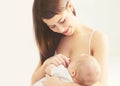 Portrait happy smiling mother feeding breast her baby at home Royalty Free Stock Photo