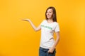 Portrait of happy smiling satisfied woman in white t-shirt with written inscription green title volunteer isolated on Royalty Free Stock Photo