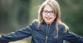 Portrait of a happy smiling teenage girl with dental braces and glasses Royalty Free Stock Photo