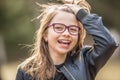 Portrait of a happy smiling teenage girl with dental braces and glasses Royalty Free Stock Photo