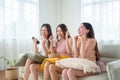 Asian Women cheering on Television