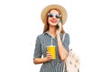 Portrait of happy smiling woman calling on smartphone with cup of juice wearing straw hat, backpack isolated on white background Royalty Free Stock Photo