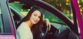 Portrait of happy smiling woman driver behind a wheel car Royalty Free Stock Photo